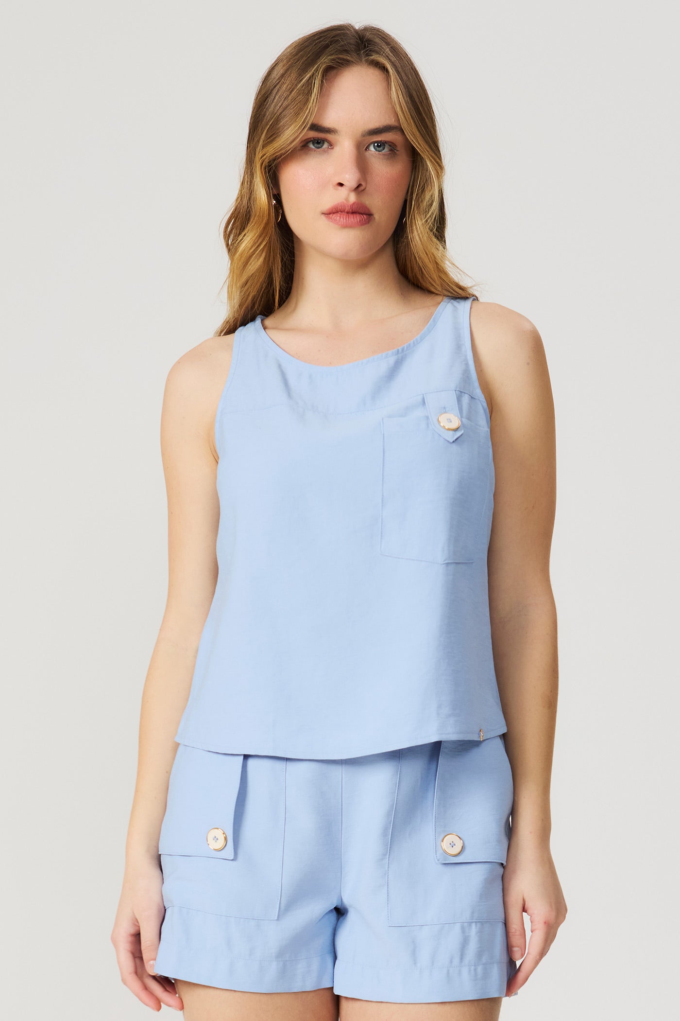 Blusa regata azul com bolso frontal Fato Básico